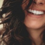 Dental Care - long black haired woman smiling close-up photography