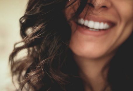 Dental Care - long black haired woman smiling close-up photography