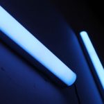 UV Lighting - a close up of a toothbrush and a tube of toothpaste