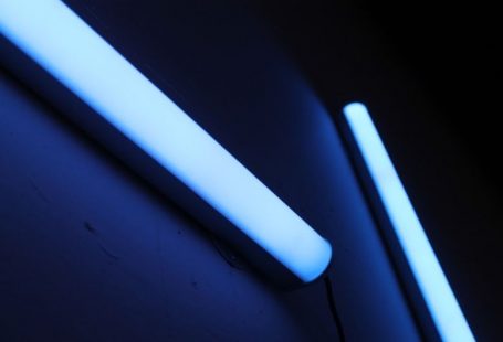 UV Lighting - a close up of a toothbrush and a tube of toothpaste