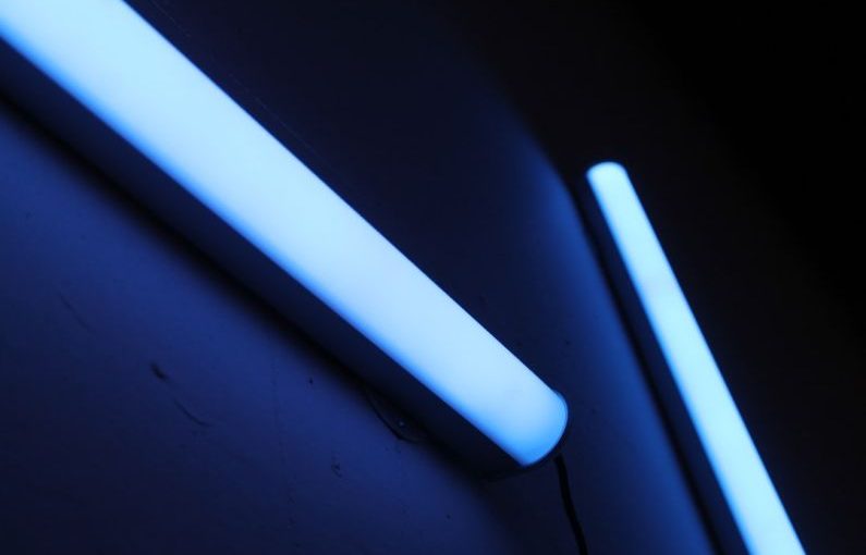 UV Lighting - a close up of a toothbrush and a tube of toothpaste