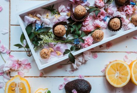 Healthy Treats - sliced oranges beside plate of round pastries